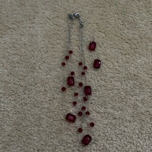 Layered red beaded necklace and drop earrings